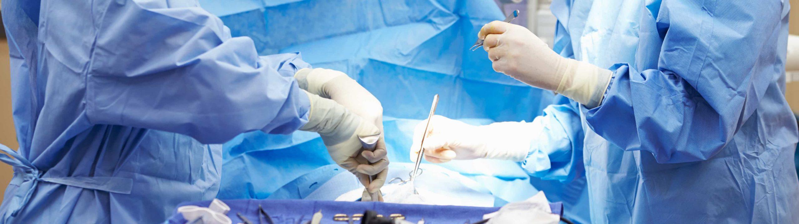 Surgeons operate on a patient in an operating room